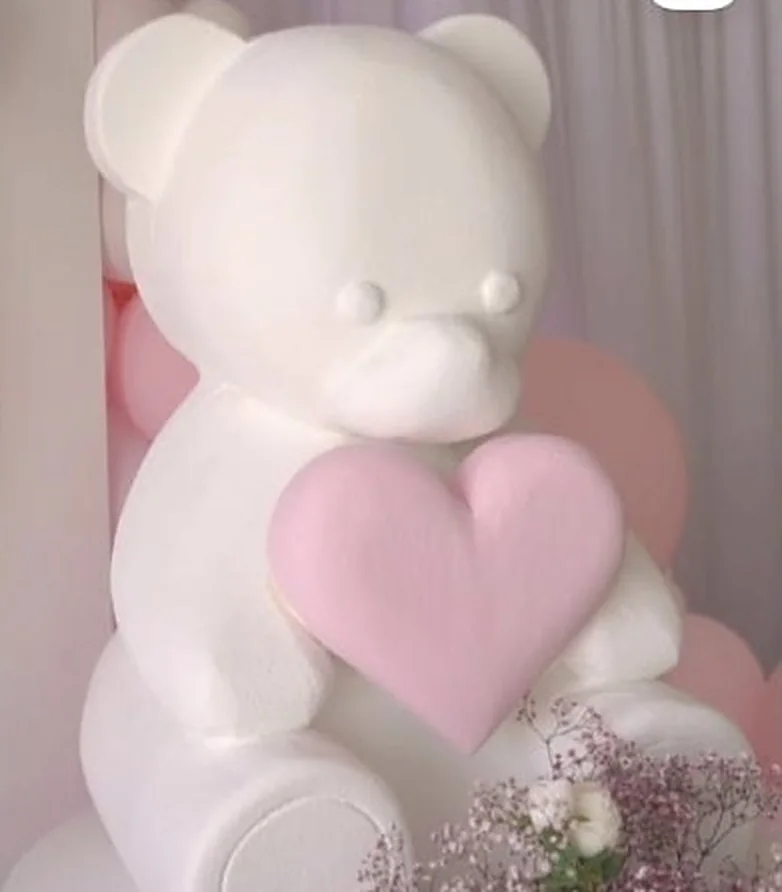 Weißer Teddybär mit rosa Herz